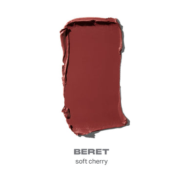 Red lipstick swatch labeled 