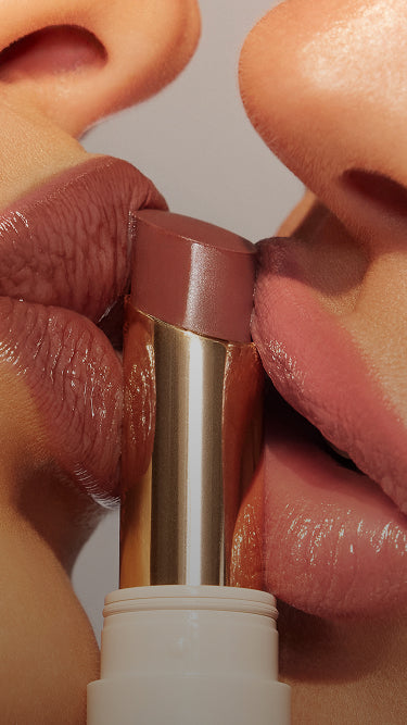 Image of Morphe Liplock Glossy lipstick. Models kissing Liplock product.